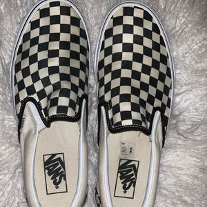 White and black checkerboard vans
